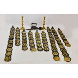 A group of metalware comprising a pair of brass candlesticks,