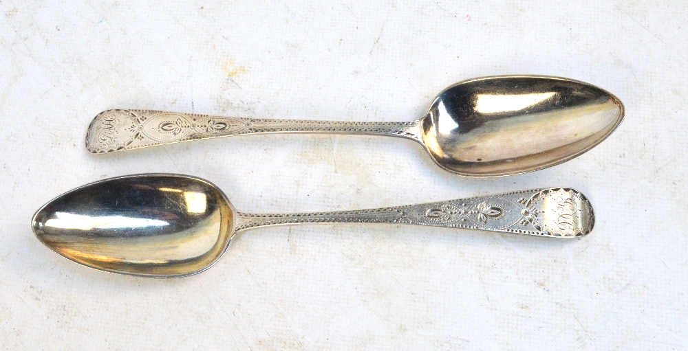 A pair of George III hallmarked silver Old English pattern tablespoons with bright cut decoration