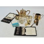 A small quantity of electroplated items including a three piece tea service of oval tapering form