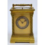 A late 19th century brass carriage clock cornered with writhen columns with Corinthian capitals,