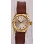 ROLEX; a lady's 9ct gold wristwatch with gold batons to the hour points and leather strap, boxed.