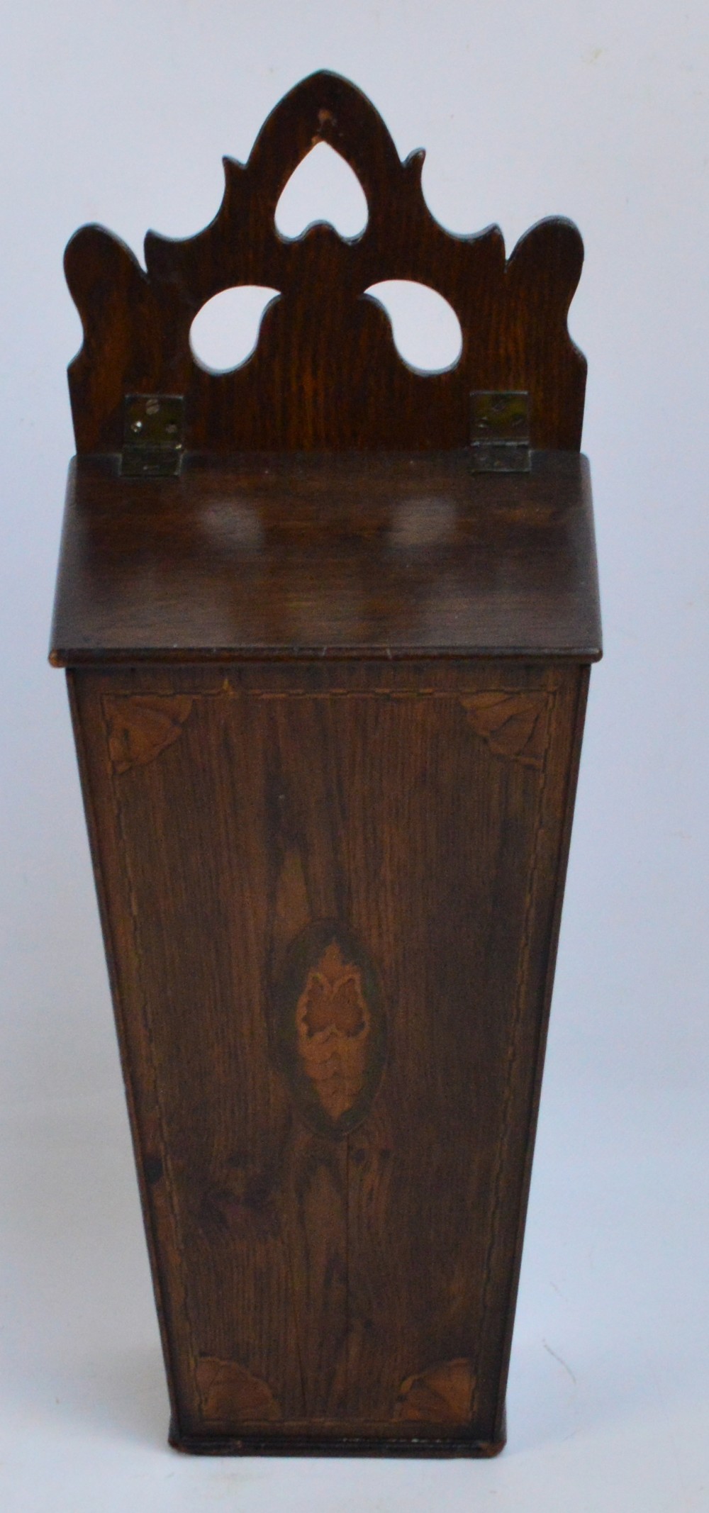 An early Georgian oak and inlaid salt box of rectangular tapering form, decorated with shell motifs,