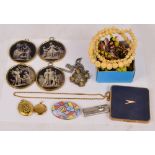 A small group of costume jewellery comprising four pendants on chains, a carved bone bead necklace,