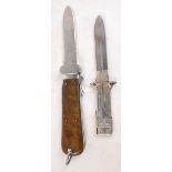 An early 20th century Gravity Drop knife with Solingen blade and walnut mount with hinged spike to