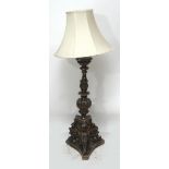 A decorative gilded pricket candlestick, converted to electricity.