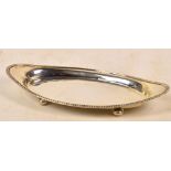 An Edward VII hallmarked silver navette shaped dish with rope twist decorated rim,
