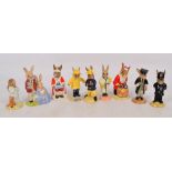 Nine Royal Doulton Bunnykins figures; DB75 "Fireman", DB17 "Santa Happy Christmas", DB68 "Father,