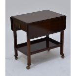 A mid 20th century tea trolley with folding leaves,