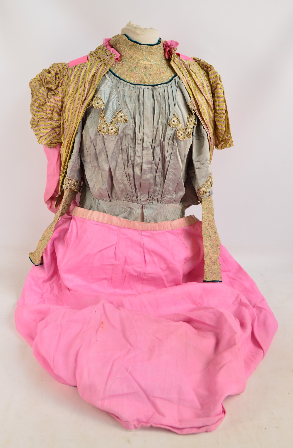 An Edwardian lace adorned pleated jacket with floral decoration,