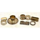 A pair of Edward VII hallmarked silver waisted circular napkin rings with embossed borders,