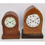 A 1930s mahogany lancet shaped mantel clock with associated plinth,