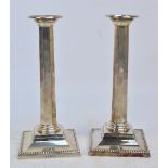 A pair of George V hallmarked silver candlesticks of tapering octagonal form,