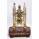 An early 19th century brass Gothic skeleton clock,