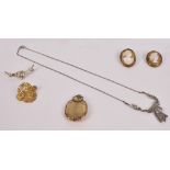 A small group of costume jewellery comprising two yellow metal mounted cameo brooches,