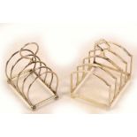 A George V hallmarked silver four division toast rack of arched form with central loop handle,