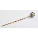 A yellow metal diamond and cultured pearl floral set stick pin, length 6.2cm.