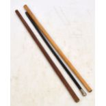 A white metal mounted ebonised swagger stick, a cane swagger stick and a leather example,