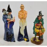 Three Royal Doulton figures; HN2103 "The Mask Seller", HN2877 "The Wizard" and HN2989 "The Genie".