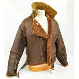 A WWII leather flying jacket, formerly the property of a Naval Air Gunner.