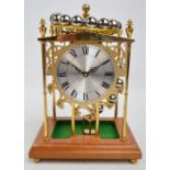 A late 20th century falling ball clock or spherical weight clock, with 24 balls, paddle wheel,