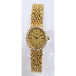 BUECHE-GIROD; a lady's 18ct yellow gold diamond set wristwatch,