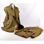 A khaki overcoat and jacket and trousers complete with leather shoulder strap and belt.