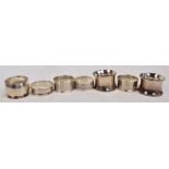 Two pairs of George V hallmarked silver silver napkin rings by Charles Horner,