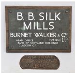 A metal and wood office sign for "B.B.