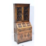 A reproduction oak bureau bookcase,