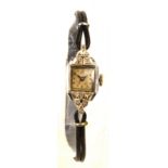 An Art Deco platinum cased manual wind lady's cocktail wristwatch, set with ten diamonds,