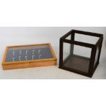 A modern wall hanging display case and a square section display case (2).