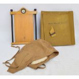 A military cartographer's map holder with leather strap,