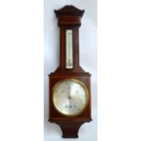 An Edwardian mahogany and satinwood banded barometer/thermometer with circular dial within a square