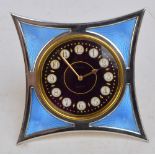 An unusual French hallmarked silver and enamel decorated easel backed timepiece,