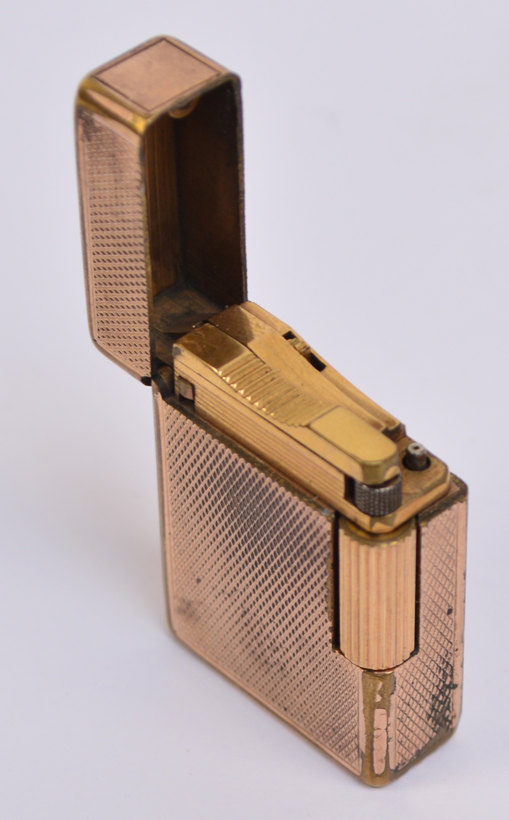 A St Dupont rolled gold lighter with overall engine turned decoration, 4.7 x 3.5cm.