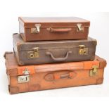 A large vintage leather suitcase with internal straps, width 69cm,