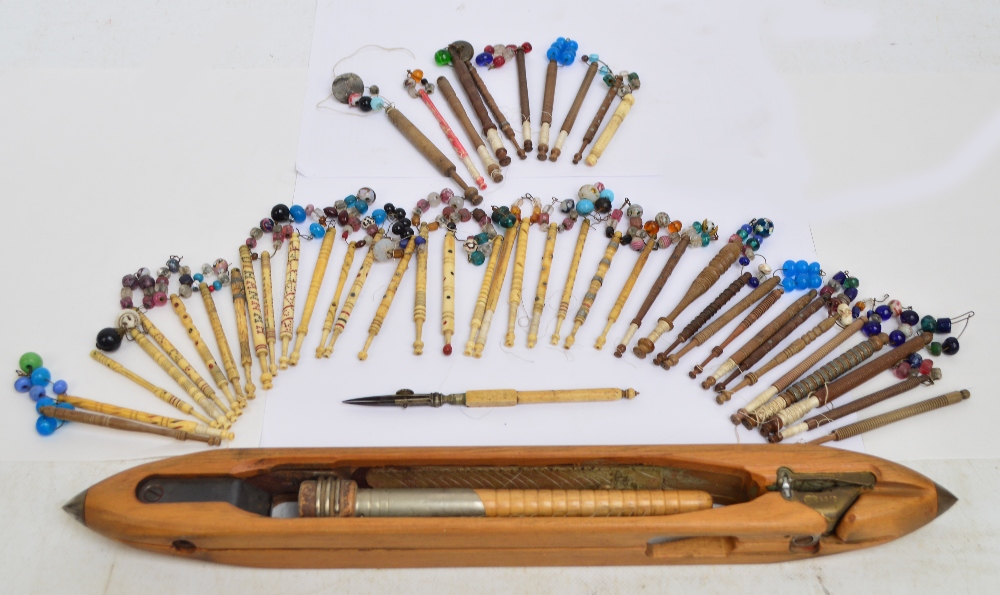 A collection of early 19th century lace making bobbins or thread carriers,