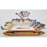A collection of early 19th century lace making bobbins or thread carriers,