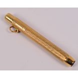 A 9ct yellow gold propelling pencil with engine turned decoration,