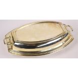 A George VI hallmarked silver entree dish and twin handled cover of convex form with lined