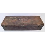 A vintage canvas leather bound suitcase and a large rectangular tin trunk inscribed "Mrs D.W.