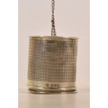 An Edward VII hallmarked silver tea infuser of pierced cylindrical form with adjustable inside