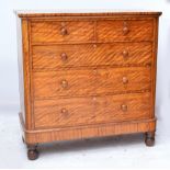 A Victorian satin birch chest of two short and three long drawers raised on bun feet,