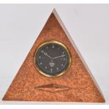 A Smiths dashboard clock with black painted dial set with Arabic numerals mounted within an Art