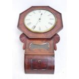 An early 20th century walnut wall clock, the circular dial in octagonal frame,