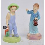 Two Royal Doulton figures; HN2050 "Wee Willie Winkie" and HN2040 "Golliwog" (af) (2).