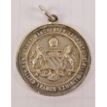 A hallmarked silver "First Manchester Laundry and Allied Trades Exhibition 1913" medal,