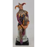 A Royal Doulton figure; HN2016 "The Jester" in purple and grey colourway.