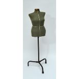 A tailor's dummy mannequin on tubular adjustable tripod stand.