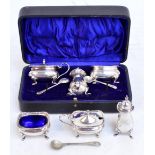 A cased Elizabeth II hallmarked silver three piece cruet set comprising a pepper of baluster form